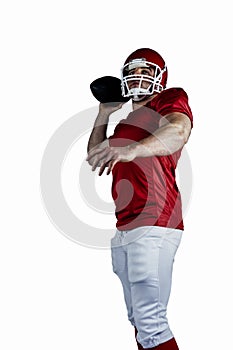 American football player throwing ball