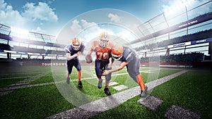 American football players in the action on stadium photo