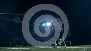 American football players competing on a field, close up.