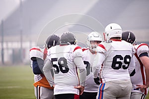 American football players discussing strategy