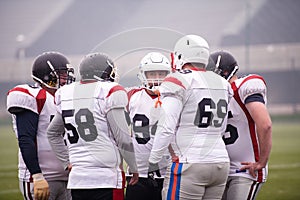 American football players discussing strategy