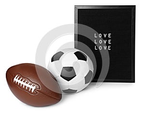 American football and soccer ball near letter board with words Love on white background