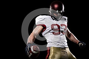 American football sportsman player on stadium with lights on background