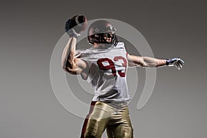 American football sportsman player on stadium with lights on background