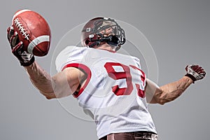 American football sportsman player on stadium with lights on background