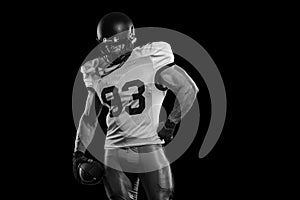 American football sportsman player on stadium with lights on background