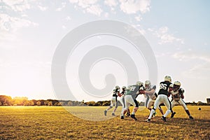 American football team doing defensive drills during a practice