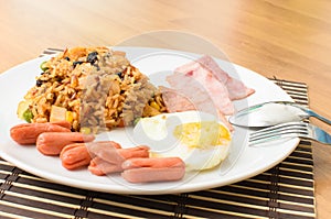 American fried rice with pork sausage, bacon and fried egg
