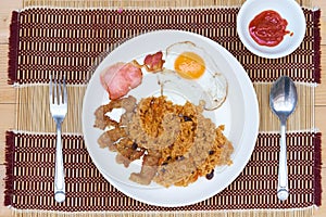 American fried rice is a Thai fried rice dish with `American` side ingredients like fried egg, fried