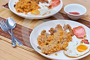 American fried rice is a Thai fried rice dish with `American` side ingredients like fried egg, fried