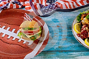 American game football food on blue wooden background