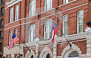 American and Georgia flags on Old Brick Building