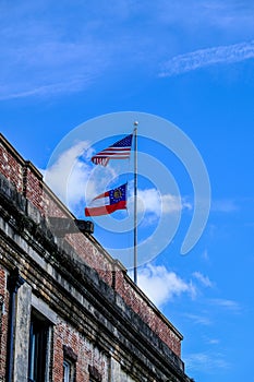 American and Georgia Flags Over Old Brick