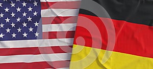 American and German flags. Linen flag close-up. Flag made of canvas. United States of America. German. State national symbols. 3d