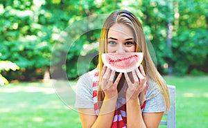 American girl eating watermelon