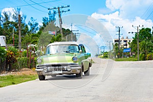 American green 1957 vintage car on the country street to Havana City Cuba - Serie Cuba Reportage