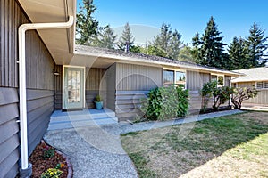 American grey rambler house exterior with entrance porch