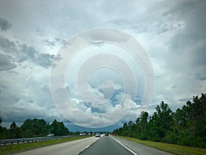 American highway with clouds photo