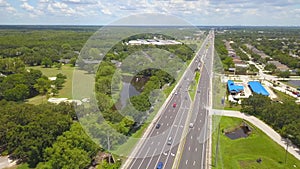 American Highway or Freeway road. Traffic on the way. Wide and straight road with many lanes