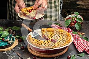 American homemade cherry pie, Female hands holding whole homemade cherry pie, banner, menu, recipe place for text, top view