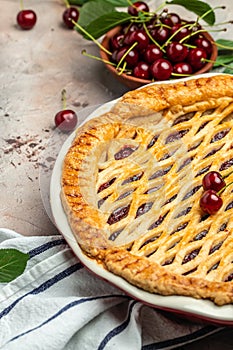 American homemade cherry pie, Female hands holding whole homemade cherry pie, banner, menu, recipe place for text, top view
