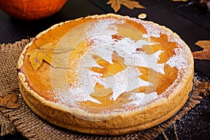 American homemade pumpkin pie with cinnamon and nutmeg