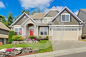 American house with beautiful landscape and vivid flowers