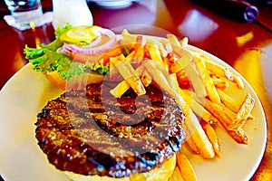 American Juicy Burger with Tomato, lettuce and French Fries