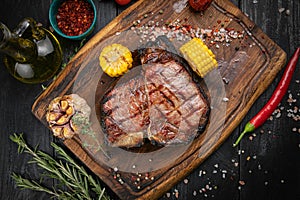 American juicy T-Bone steak on the board photo