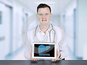 American male doctor showing hepatitis word