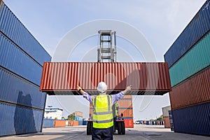 American man Foreman control loading containers box to truck for logistics export  of International global shipping