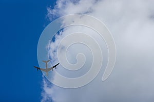 American military transport cargo aircraft of the U.S. Air Force flying at high speed across the sky.