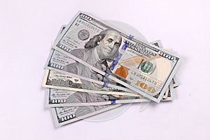 American Money in 100.00 bills piled high