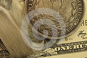 American money background. Dollar coins and banknote fragments closeup