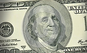 American money - one hundred dollars banknote with satisfied expression