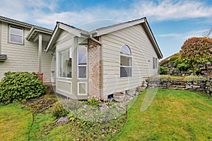 American Northwest winter time home exterior with beige color and brick