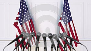 American official press conference. Flags of the United States and microphones. Conceptual 3D rendering