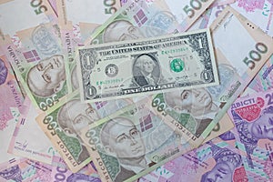 American one dollar banknote and ukrainian hryvnas. Corruption in Ukraine. Money background.