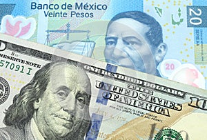 American one hundred dollar bill with a blue twenty peso note from Mexico photo