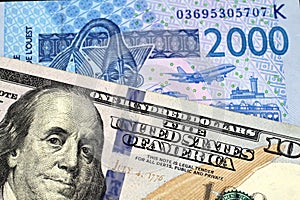 An American One Hundred Dollar Bill With A West African Franc Banknote
