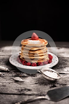 American pancakes isolated on dark background