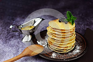 American pancakes on a plate with honey photo