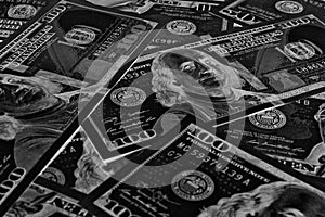 American paper money. 100 dollar and other US bills. Black and white background or wallpaper. Savings economy and the USA dollar.