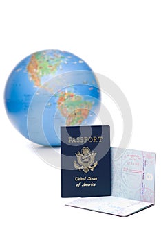 American passports stamped with travel visas in front photo