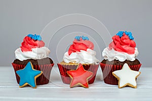 American patriotic themed cupcakes for the 4th of July with ginger stars. Shallow depth of field.