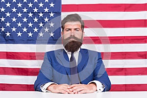 American patriotism. American citizen in formalwear. Bearded man on american flag background. Independence day. July 4th