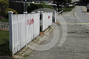 American patriotism .. american flag on white picket fence