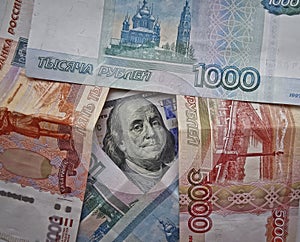 The American president with a 100-dollar bill surrounded by Russian rubles. The dollar against the ruble.