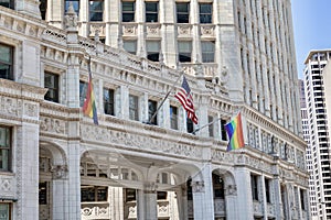 American and Pride flags on a building in Chicago