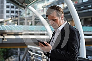 American professional businessman using smart phone